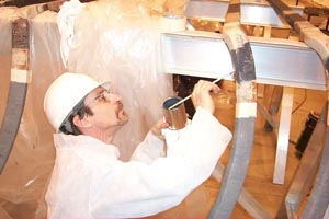 An ASOPE Power Engineer Preps Suppressor Areas for Stator Bars