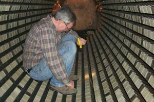 A Power Engineer with Inspection Credentials Inspecting Stator Core